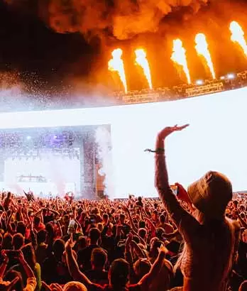 Incredible moment from the Arc Stage at Creamfields with 70,000 audience illuminated by pyro and the enormous IMAG screens directed by John Surdevan