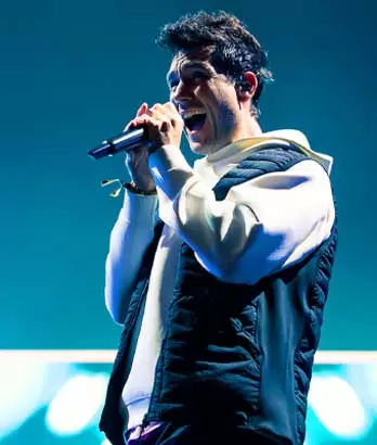 Dan Smith from Bastille singing at Kendal Calling festival 2024 during Surdevan's multi-camera IMAG broadcast